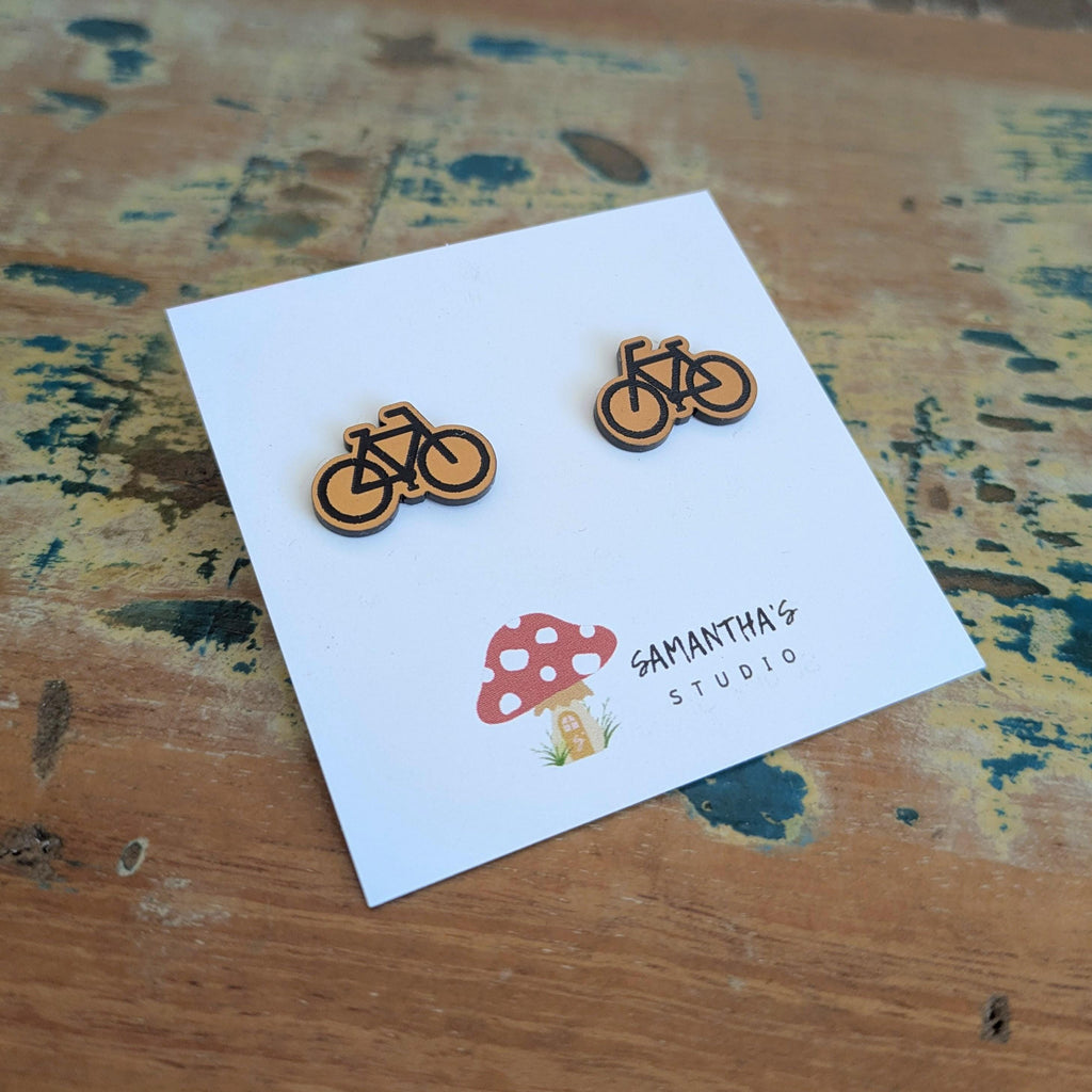 Push Bike Stud earrings in gold and black