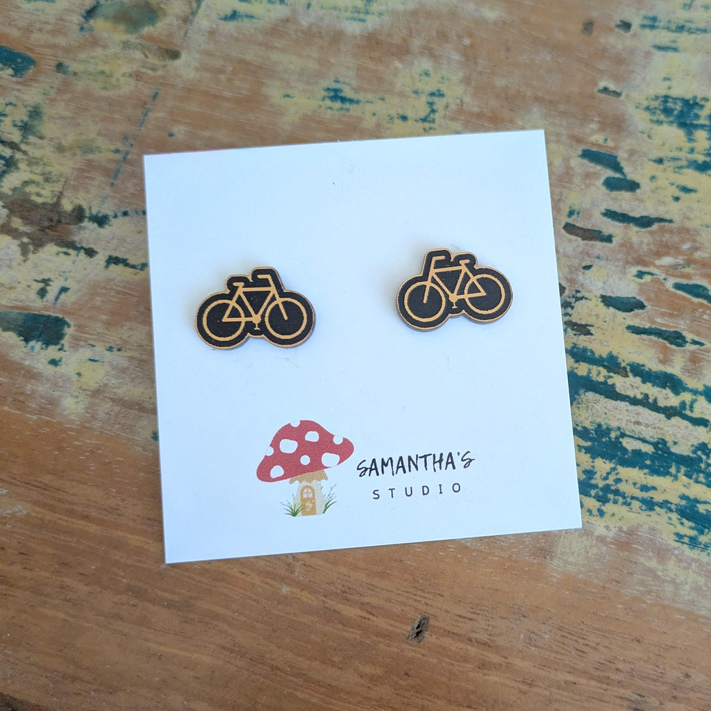 Push Bike Stud earrings in gold and black