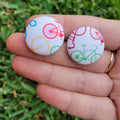 Bike button stud earrings