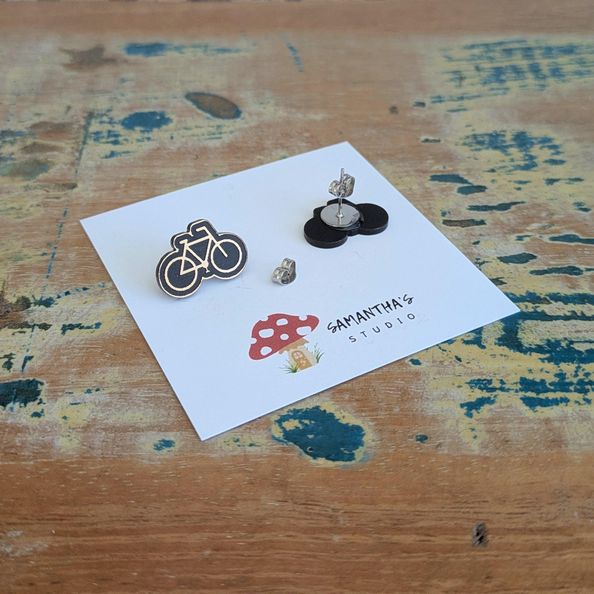 Push Bike Stud earrings in gold and black