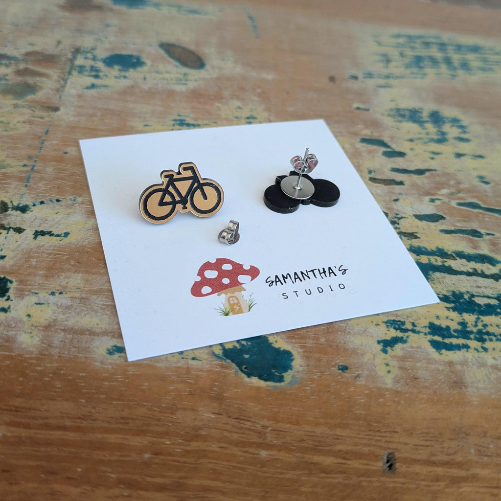Push Bike Stud earrings in gold and black